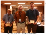 Larry Ritter Award winners Chuck Kimberly, left, and Nathaniel Grow, right, pose with Dr. Charles Alexander in Chicago.